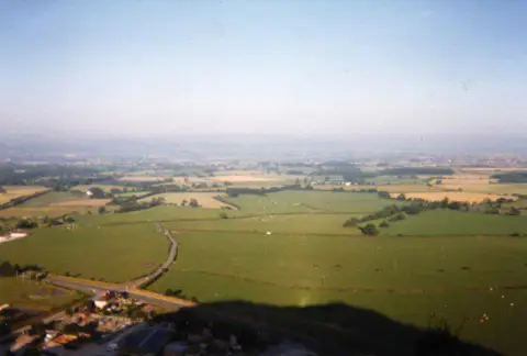 SJ0580 : Dawn on Graig Fawr as it casts its shadow on the land