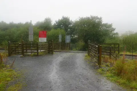 SH5749 : Crossing on the Welsh Highland Railway