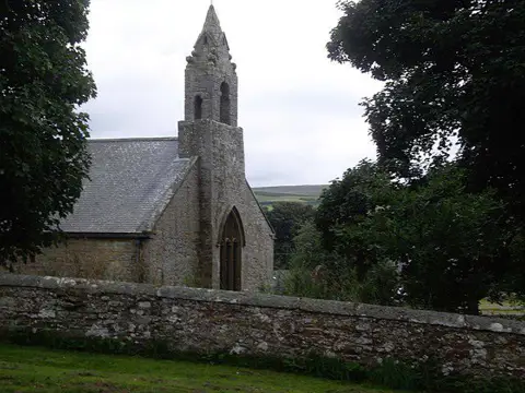 NY9393 : Bell tower and west window of St Cuthbert's
