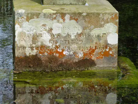 NT9502 : Plinth of the cross in Lady's Well